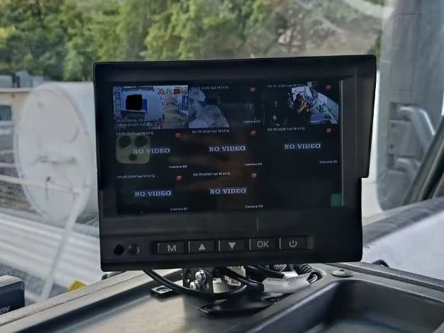 Cab monitor showing the truck's cameras in a split view